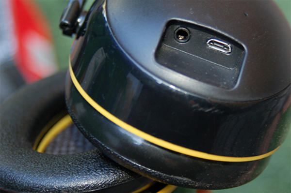 Close-up of 3M WorkTunes micro-USB charging port and 3.5mm auxiliary input