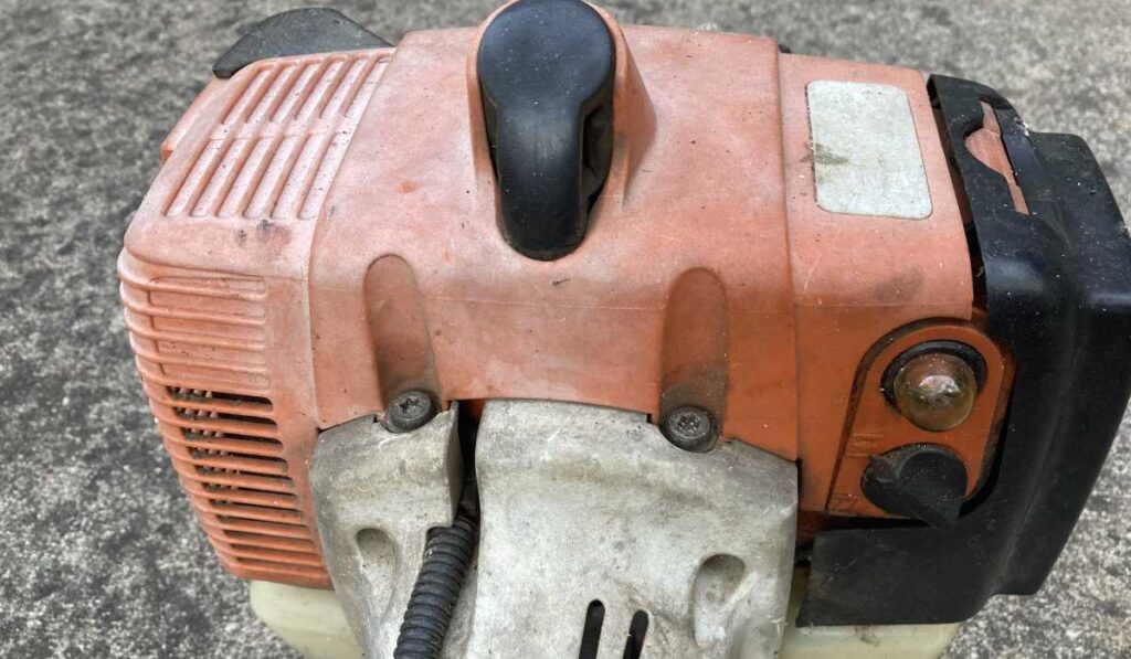 Stihl FS 200 shroud, primer bulb, air filter cover, and clutch housing.